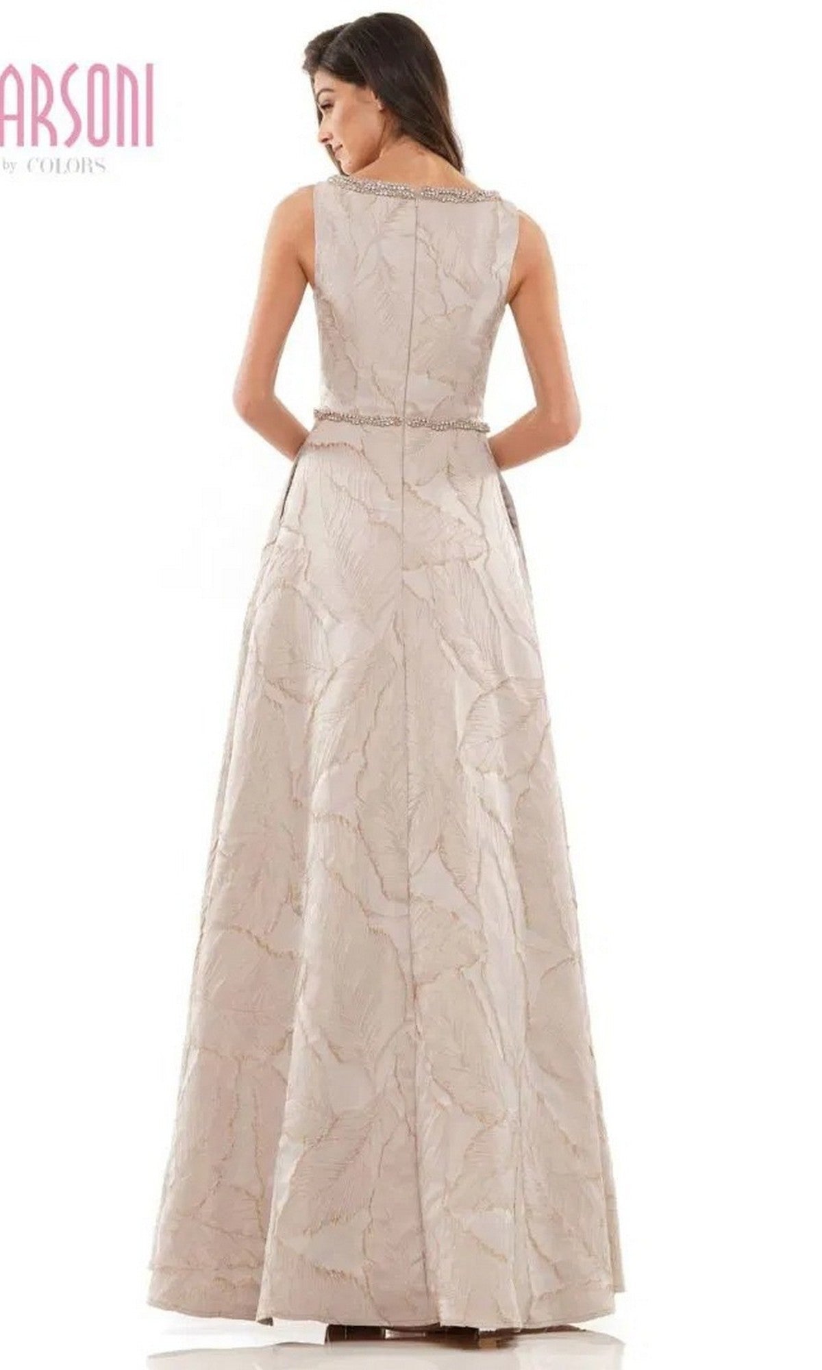 A woman shown from the back wears the Marsoni MV1224 Long Formal Dress, a sleeveless, floor-length gown with a delicate leaf jacquard pattern and a fitted waist.